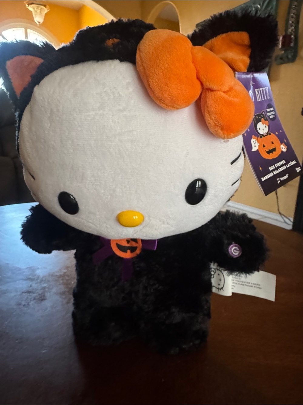 Sanrio Hello Kitty Black Plush Halloween Costume with Orange Bow Side Stepper